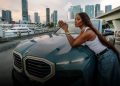 Naomi Campbell poses on BMW XM