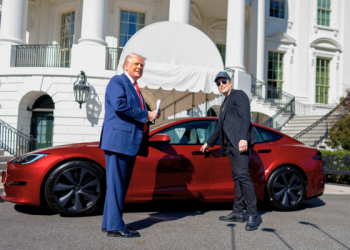 Trump and Elon Muck Pose With a Tesla