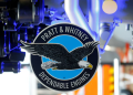 The logo of Pratt & Whitney is seen in front of a F135-PW-100 fighter aircraft engine