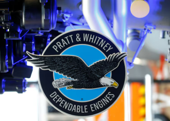 The logo of Pratt & Whitney is seen in front of a F135-PW-100 fighter aircraft engine