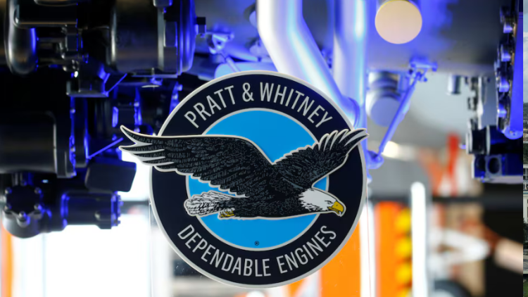 The logo of Pratt & Whitney is seen in front of a F135-PW-100 fighter aircraft engine